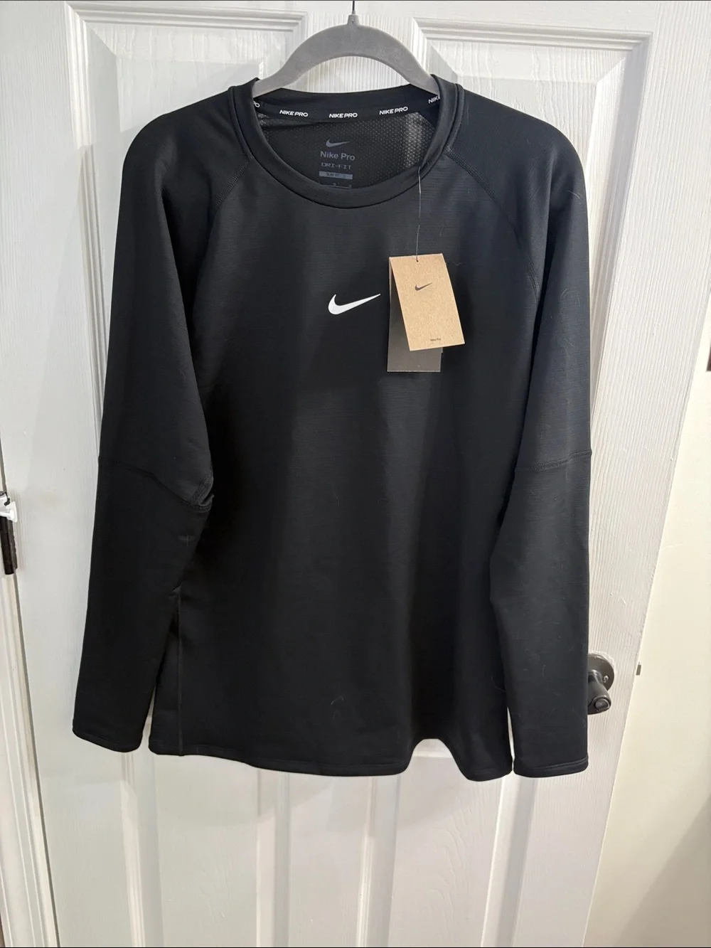 Nike Black Long Sleeve Performance Shirt with White Swoosh